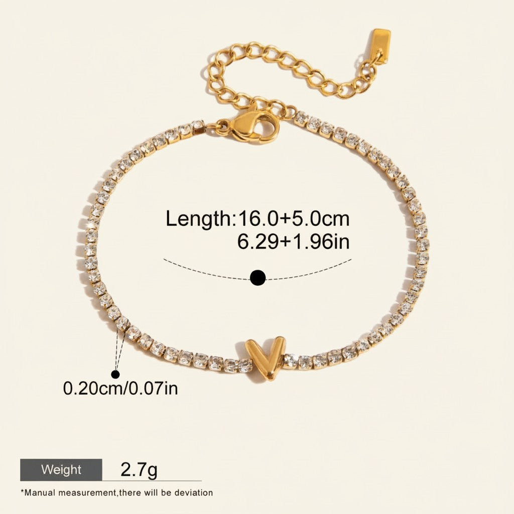 Seraphina Treasures gold-tone tennis bracelet with clear cubic zirconia and a gold letter V charm. Adjustable length, waterproof and hypoallergenic.
